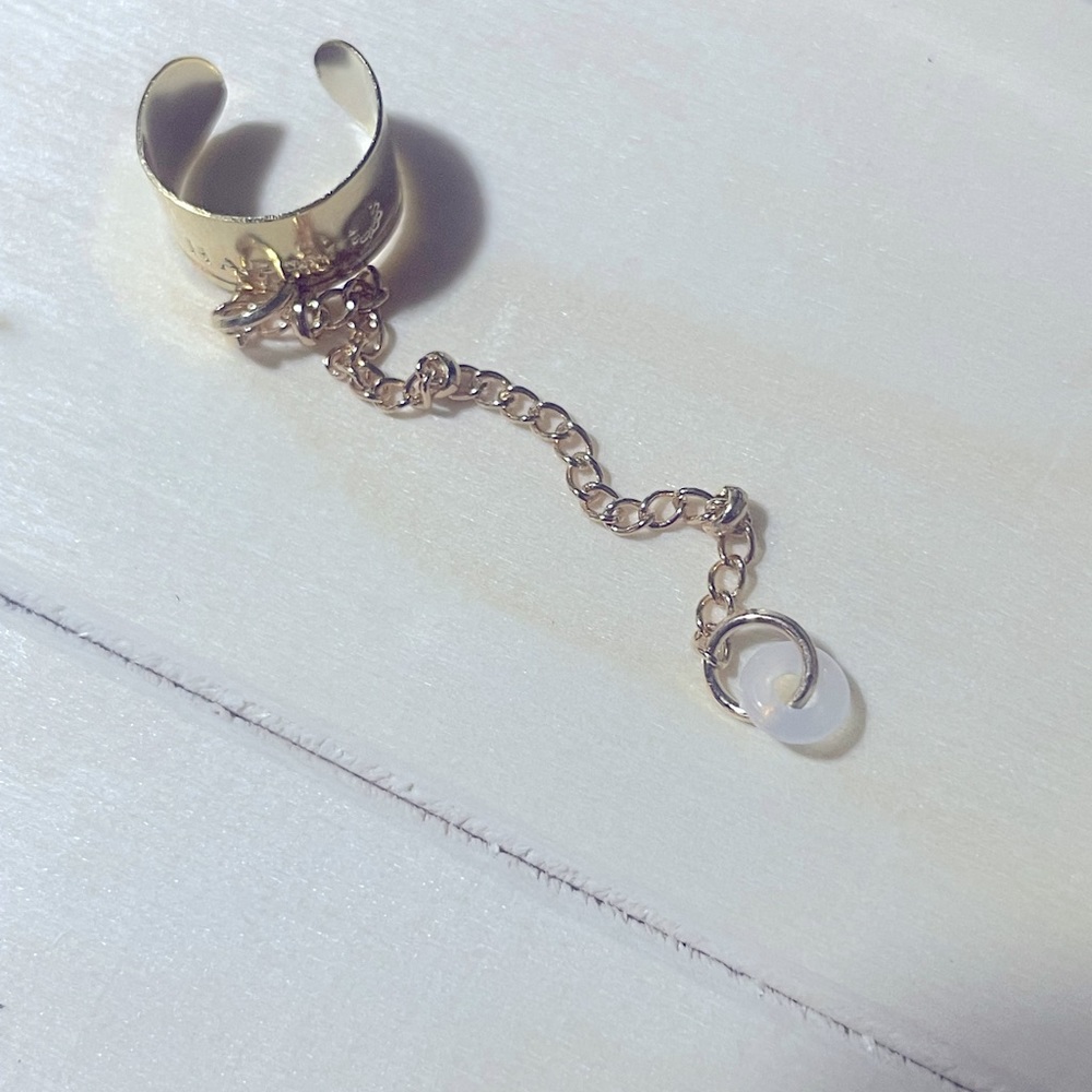 Gold ear cuff ear bud holder